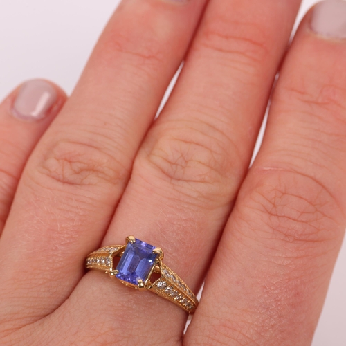 1260 - An 18ct gold tanzanite and diamond ring set with octagonal step-cut tanzanite and modern round brill... 