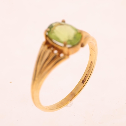 1264 - A 9ct gold single stone peridot dress ring, maker CG&S, Birmingham 1985, claw set with oval mixed-cu... 