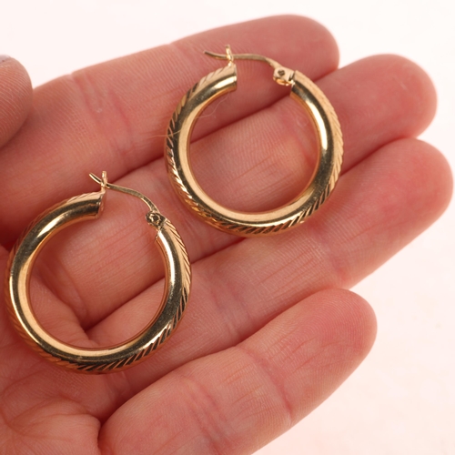 1267 - A pair of 9ct gold hoop earrings, maker FH Ltd, import London 1994, 26.7mm, 3.7g