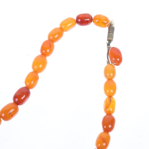 1271 - A Vintage single-strand graduated butterscotch amber bead necklace, beads ranging from 27.4 - 12.8mm... 