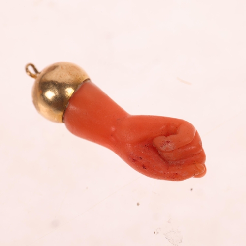 1279 - An Antique Italian coral Figa fist amulet pendant, modelled as a clenched fist, unmarked mount tests... 