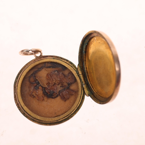 1290 - An Antique 9ct rose gold photo locket pendant, circular form with foliate engraved decoration, unmar... 