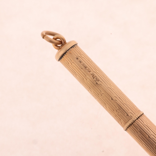 1326 - A 9ct rose gold propelling toothpick, maker SJR, Birmingham 1977, engine turned decoration, 49.6mm, ... 