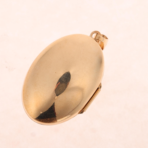 1347 - A 9ct gold bombe locket pendant, maker GA, no Birmingham date letter, oval form with foliate decorat... 