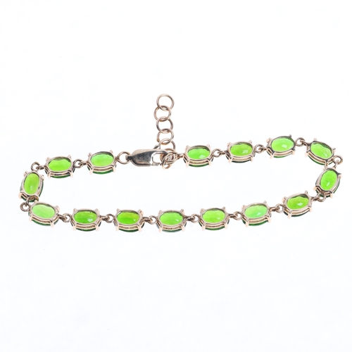 1350 - A 9ct gold peridot tennis line bracelet, set with oval mixed-cut peridots, 17.5cm, 6.3g