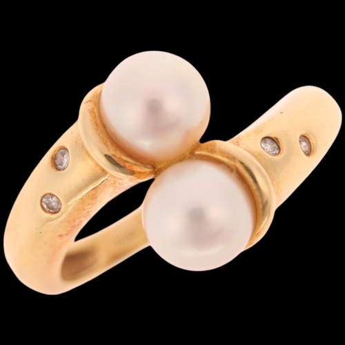 1352 - GARRARD & CO - an 18ct gold cultured pearl and diamond crossover ring, maker G & Co, import London 1... 