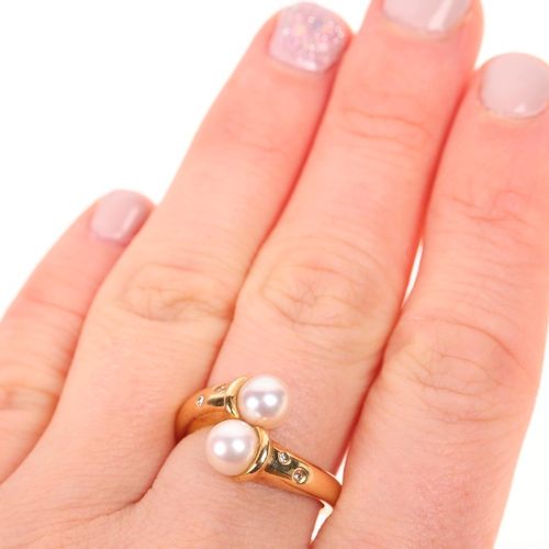 1352 - GARRARD & CO - an 18ct gold cultured pearl and diamond crossover ring, maker G & Co, import London 1... 