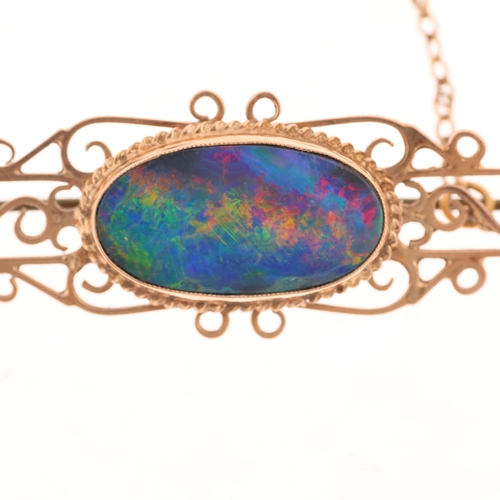 1353 - A Vintage 9ct gold black opal doublet openwork brooch, unmarked mount tests as 9ct, 52.5mm, 4g