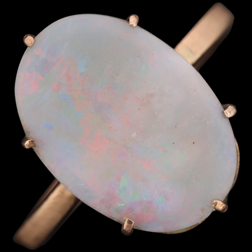 1354 - A 9ct gold single stone opal dress ring, unmarked mount tests as 9ct, setting height 16.7mm, size L,... 