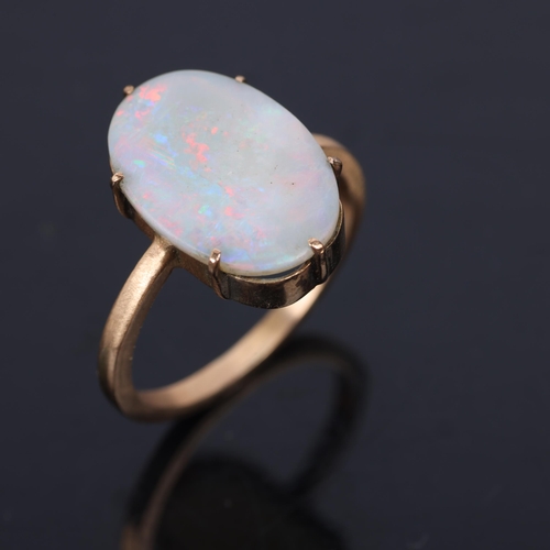 1354 - A 9ct gold single stone opal dress ring, unmarked mount tests as 9ct, setting height 16.7mm, size L,... 