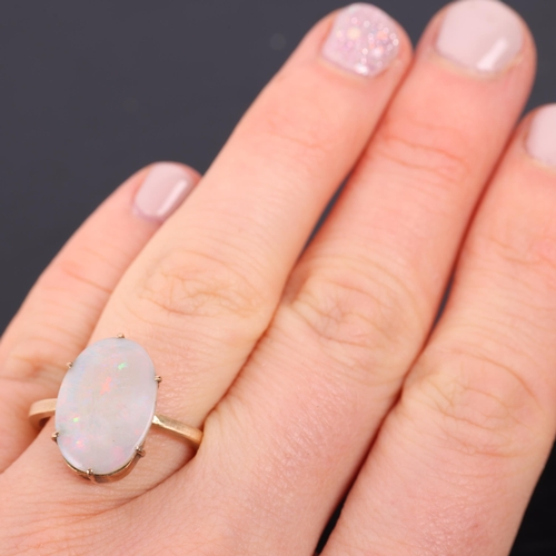 1354 - A 9ct gold single stone opal dress ring, unmarked mount tests as 9ct, setting height 16.7mm, size L,... 