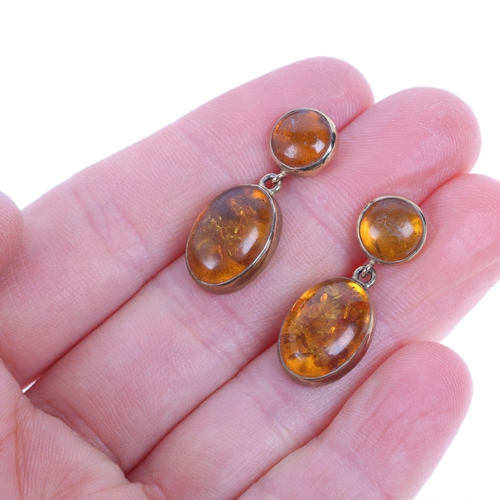 1357 - A pair of 9ct gold amber drop stud earrings, maker EWV, London 1997, set with round and oval cabocho... 