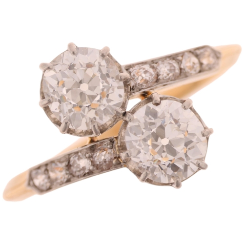 1365 - A French 18ct gold two stone diamond crossover ring, claw set with 2 x 0.75ct old European-cut diamo... 