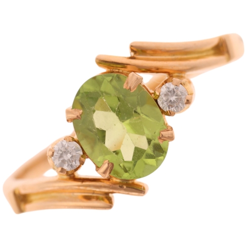 1369 - An 18ct gold three stone peridot and diamond crossover ring, set with oval mixed-cut peridot and mod... 