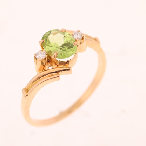 1369 - An 18ct gold three stone peridot and diamond crossover ring, set with oval mixed-cut peridot and mod... 