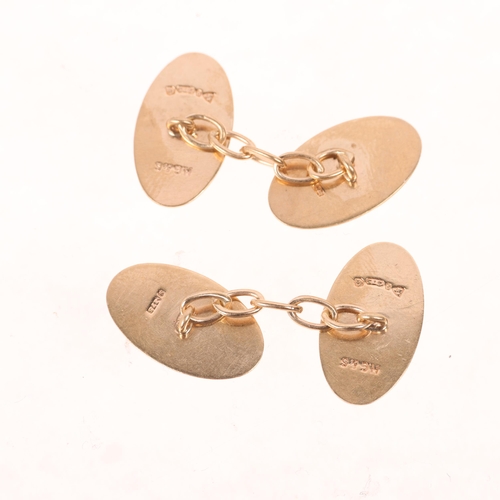 1372 - A pair of Art Deco 9ct gold oval cufflinks, maker HG&S, Chester 1932, engine turned decoration, 18.6... 