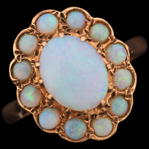 1374 - A 9ct gold opal flowerhead cluster ring, maker HBJ, London 1982, set with oval and round cabochon op... 