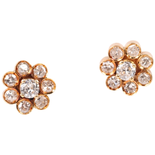 1375 - A pair of 18ct gold diamond flowerhead cluster stud earrings, set with modern round brilliant-cut di... 