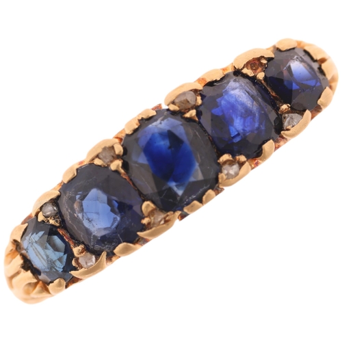 1378 - An 18ct gold five stone sapphire half hoop ring, set with oval mixed-cut sapphires, with rose-cut di... 