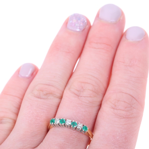 1384 - An 18ct gold seven stone emerald and diamond ring, set with round-cut emeralds and modern round bril... 