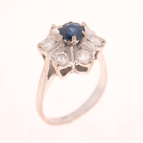 1388 - An 18ct white gold sapphire and diamond flowerhead cluster ring, set with round-cut sapphire and mod... 