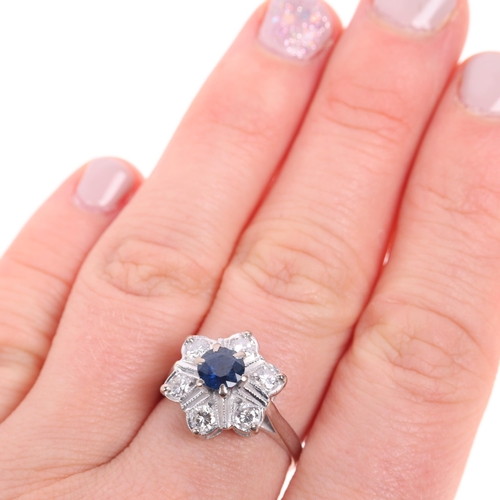 1388 - An 18ct white gold sapphire and diamond flowerhead cluster ring, set with round-cut sapphire and mod... 