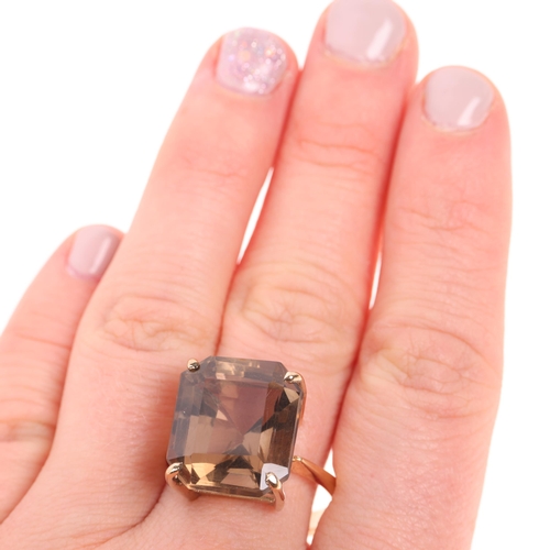 1395 - A 9ct gold smoky quartz dress ring, indistinct maker, Birmingham 1998, claw set with octagonal step-... 