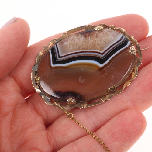 1396 - An Antique Victorian banded agate brooch, yellow metal frame, 46.8mm, 14.6g