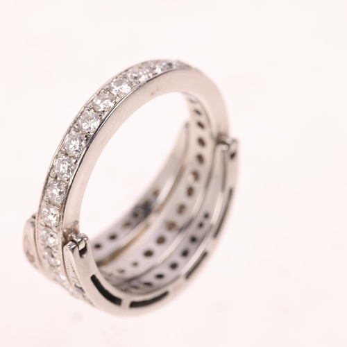 1399 - An 18ct white gold vari-hue diamond 'Day and Night' swivel eternity ring, the central band set with ... 