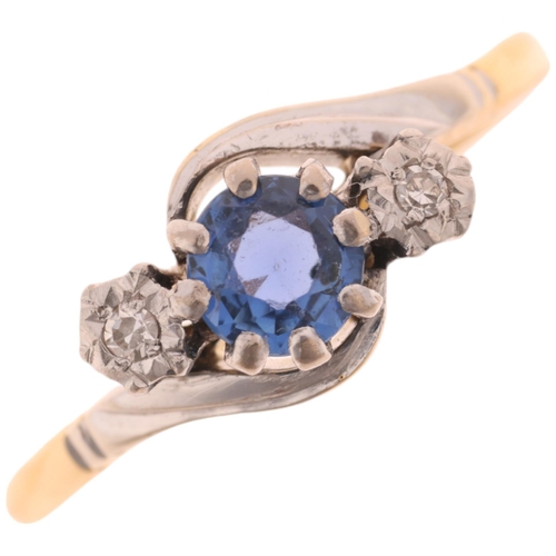 1411 - An 18ct gold three stone sapphire and diamond crossover ring, platinum-topped claw set with round-cu... 