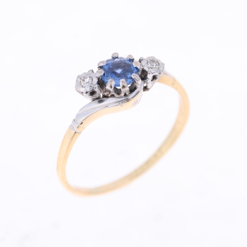 1411 - An 18ct gold three stone sapphire and diamond crossover ring, platinum-topped claw set with round-cu... 