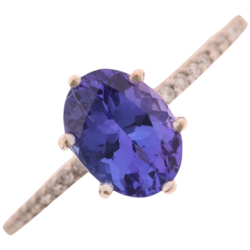 1414 - An 18ct white gold single stone tanzanite ring, maker R&G, claw set with oval mixed-cut tanzanite an... 