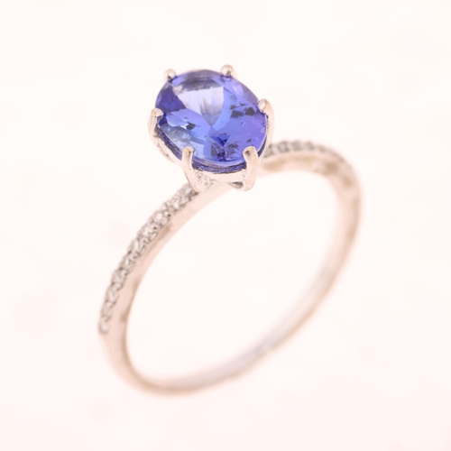 1414 - An 18ct white gold single stone tanzanite ring, maker R&G, claw set with oval mixed-cut tanzanite an... 