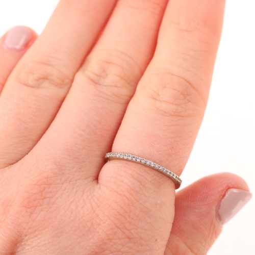 1415 - An 18ct white gold diamond half eternity ring, set with modern round brilliant-cut diamonds, band wi... 