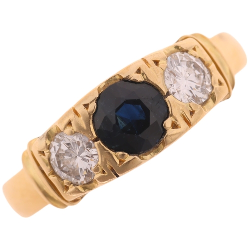 1416 - An 18ct gold three stone sapphire and diamond ring, set with round-cut sapphire and modern round bri... 