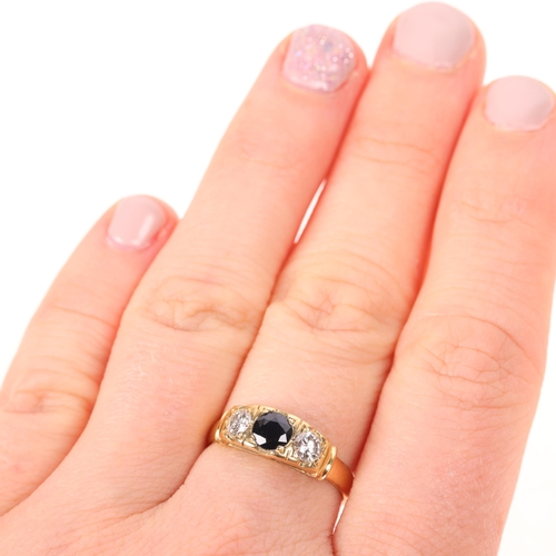 1416 - An 18ct gold three stone sapphire and diamond ring, set with round-cut sapphire and modern round bri... 