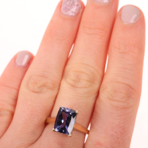 1429 - A 9ct gold single stone tanzanite dress ring, maker R&C, set with rectangular cushion-cut tanzanite,... 