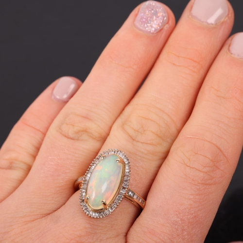 1434 - A 9ct gold opal and diamond oval cluster ring, set with oval cabochon opal surrounded by row of bagu... 