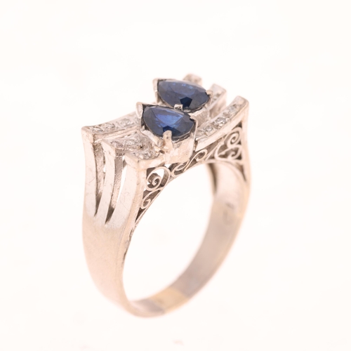 1439 - A 14ct white gold sapphire and diamond cocktail ring, in the Art Deco style, set with pear-cut sapph... 