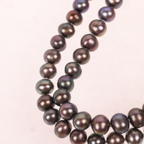 1443 - A Vintage single-strand black pearl bead necklace, with unmarked 18ct gold cube spacer link, 8.1mm p... 