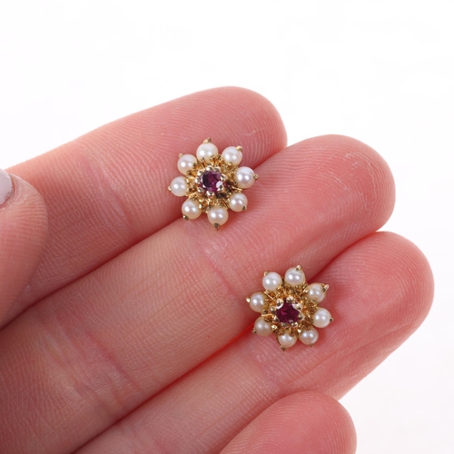 1444 - A pair of 9ct gold ruby and pearl flowerhead cluster stud earrings, 10.1mm, 1.8g