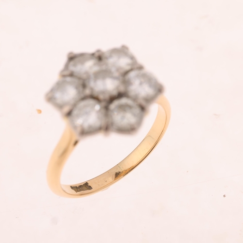 1447 - An 18ct gold seven stone diamond flowerhead cluster ring, set with modern round brilliant-cut diamon... 