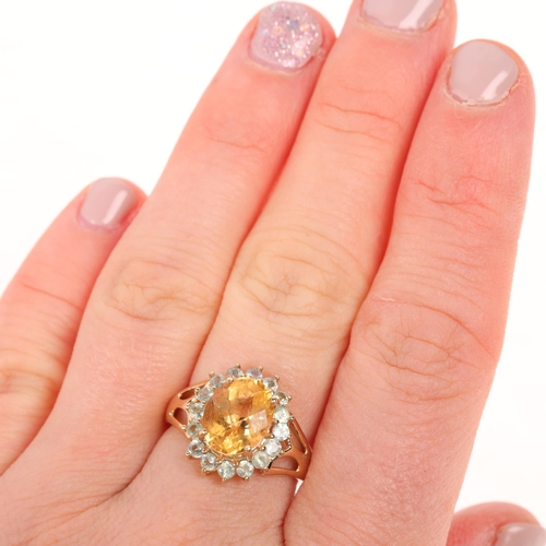 1450 - A 9ct gold gem set flowerhead cluster ring, setting height 15.3mm, size N, 3.4g