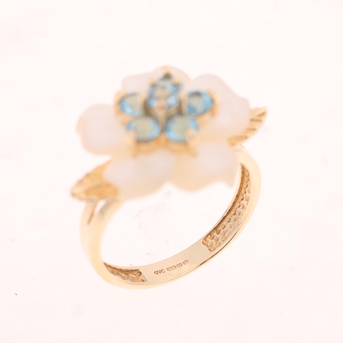 1459 - A 9ct gold blue topaz and mother-of-pearl flowerhead ring, maker QVC, Birmingham 2006, setting heigh... 