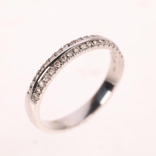 1462 - An 18ct white gold diamond half eternity band ring, maker IKS, set with modern round brilliant-cut d... 