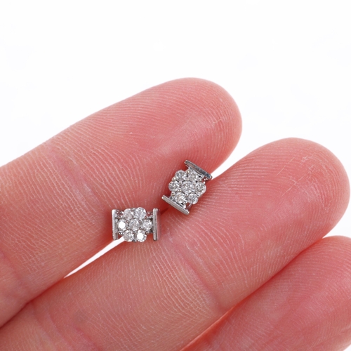 1464 - A pair of 9ct white gold diamond flowerhead cluster stud earrings, set with modern round brilliant-c... 