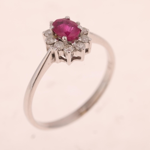 1467 - An 18ct white gold ruby and diamond oval cluster ring, set with oval mixed-cut ruby and modern round... 