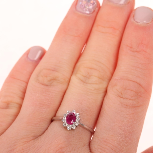 1467 - An 18ct white gold ruby and diamond oval cluster ring, set with oval mixed-cut ruby and modern round... 