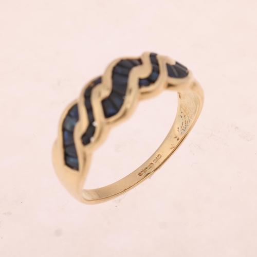 1479 - A 9ct gold sapphire wavy band ring, channel set with round and tapered baguette-cut sapphires, setti... 