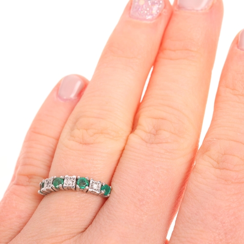 1509 - A 9ct white gold emerald and diamond half hoop ring, maker GJ, Birmingham 1987, set with round-cut e... 